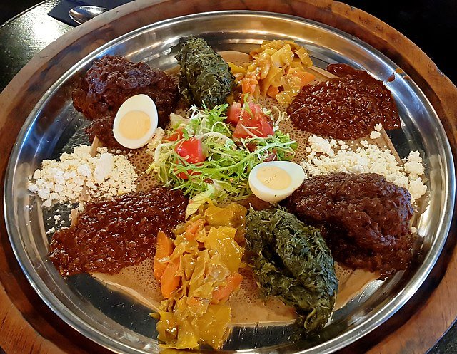 Serving Ethiopian wot stew